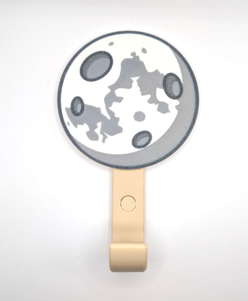 Close-up of a 3D-printed moon wall hook