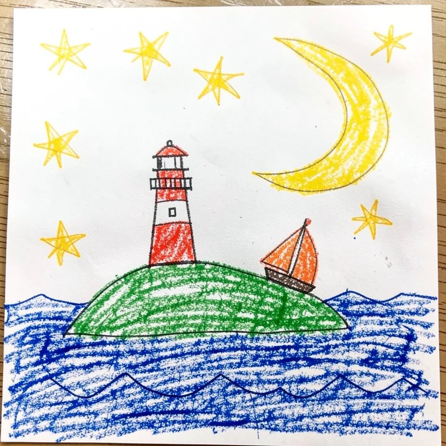 A child’s crayon drawing of a lighthouse, moon, stars, and sailboat